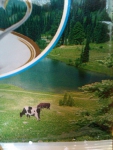 На пачке изображены мирно пасущиеся на девственных лугах коровы