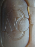 Логотип производителя на куске мыла