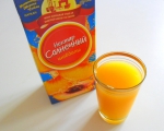 Нектар "Солнечный" сокосодержащий напиток из персика с мякотью в стакане