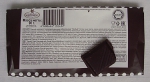Шоколад "Особый" Фабрика имени Крупской: один кусочек на фоне упаковки с составом