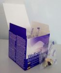 Открытая упаковка Вэлнэс Пэка и пакетик с витаминами
