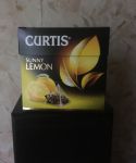 Упаковка. Чёрный чай  Curtis Sunny Lemon в пакетиках пирамидках.