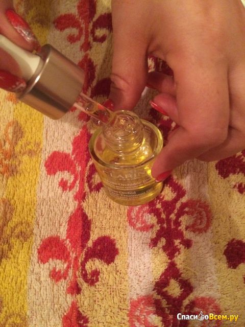 Масло для лица Clarins Huile Lotus Face Treatment Oil